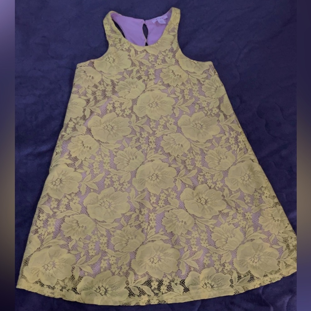 A yellow dress. XS. Has a cream color underneath dress.